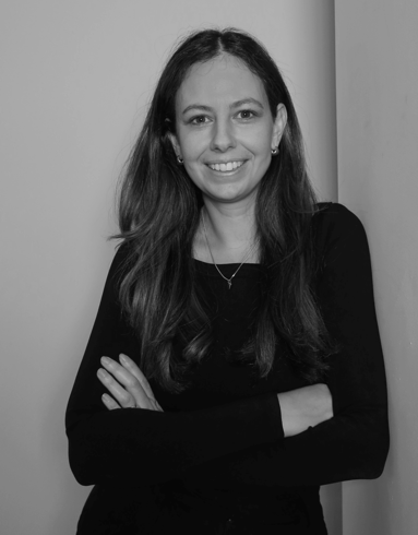 Black-and-white professional portrait of Marketing Specialist, Nina Karimalis from the Trendsetter Homes team.