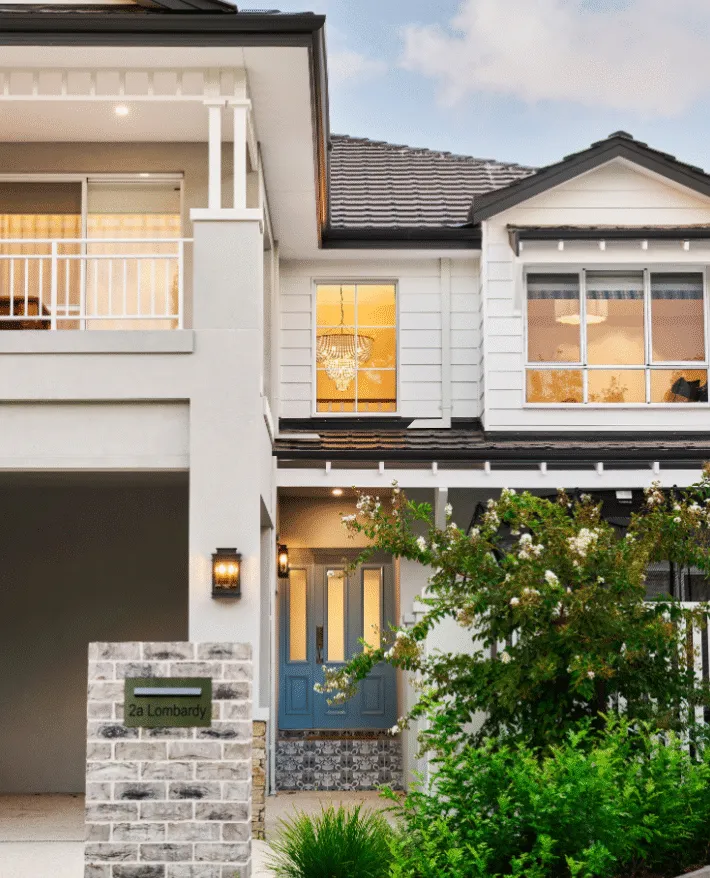 Exterior of a traditional two-storey home featuring a character-style facade, pitched rooflines and decorative architectural detailing.