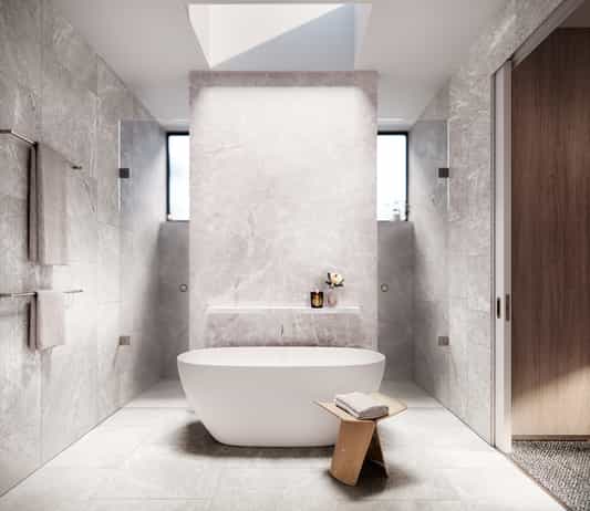 Architectural render of a bathroom featuring natural stone finishes, freestanding bath and warm lighting.