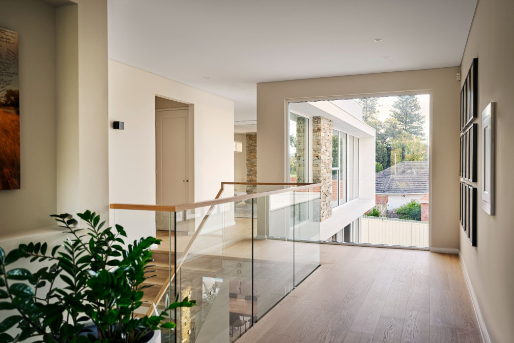 Staircase going onto second storey of a luxury two-storey home in Perth by Trendsetter Homes.